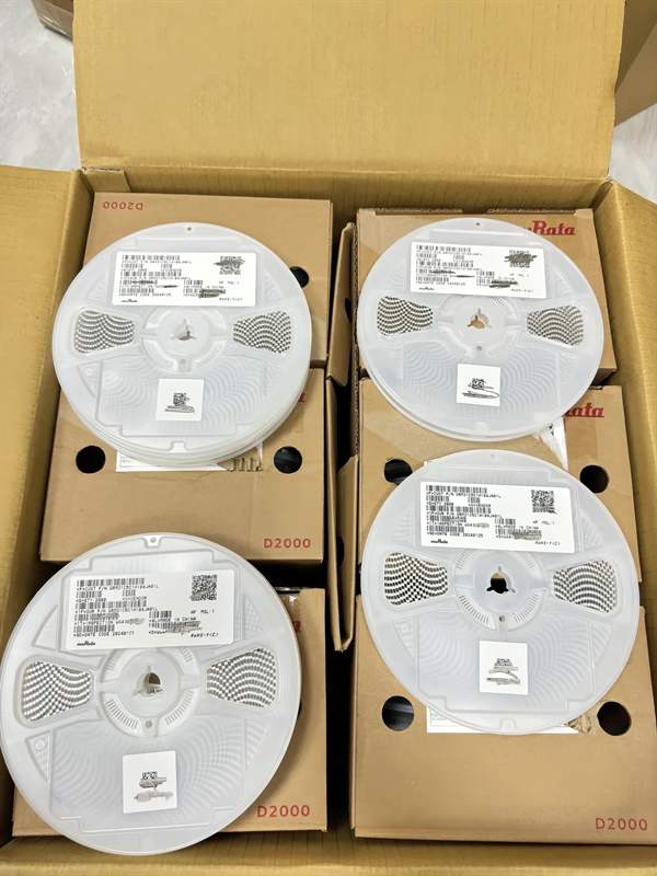 Four STMicroelectronics LM258DT factory cartons stacked, each label shows LM258DT 2500 pcs RoHS trace codes.